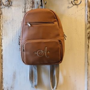 Thirty-One Boutique backpack purse w signature "A" Monogram Camel / Cognac